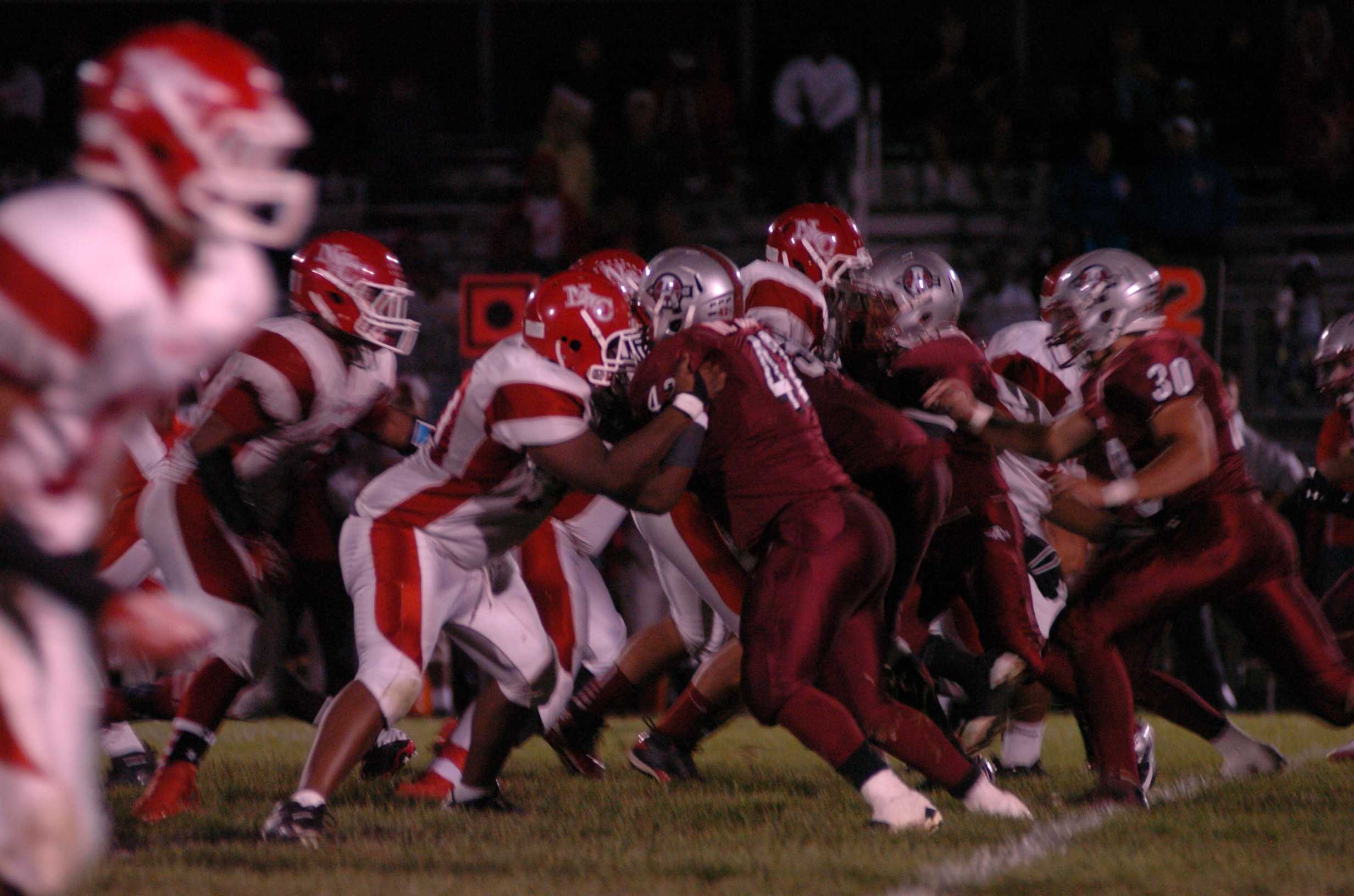 The defensive line isn't ready to give up anymore points. Senior Malik Jackson (42) and Senior Patrick Krause (28)