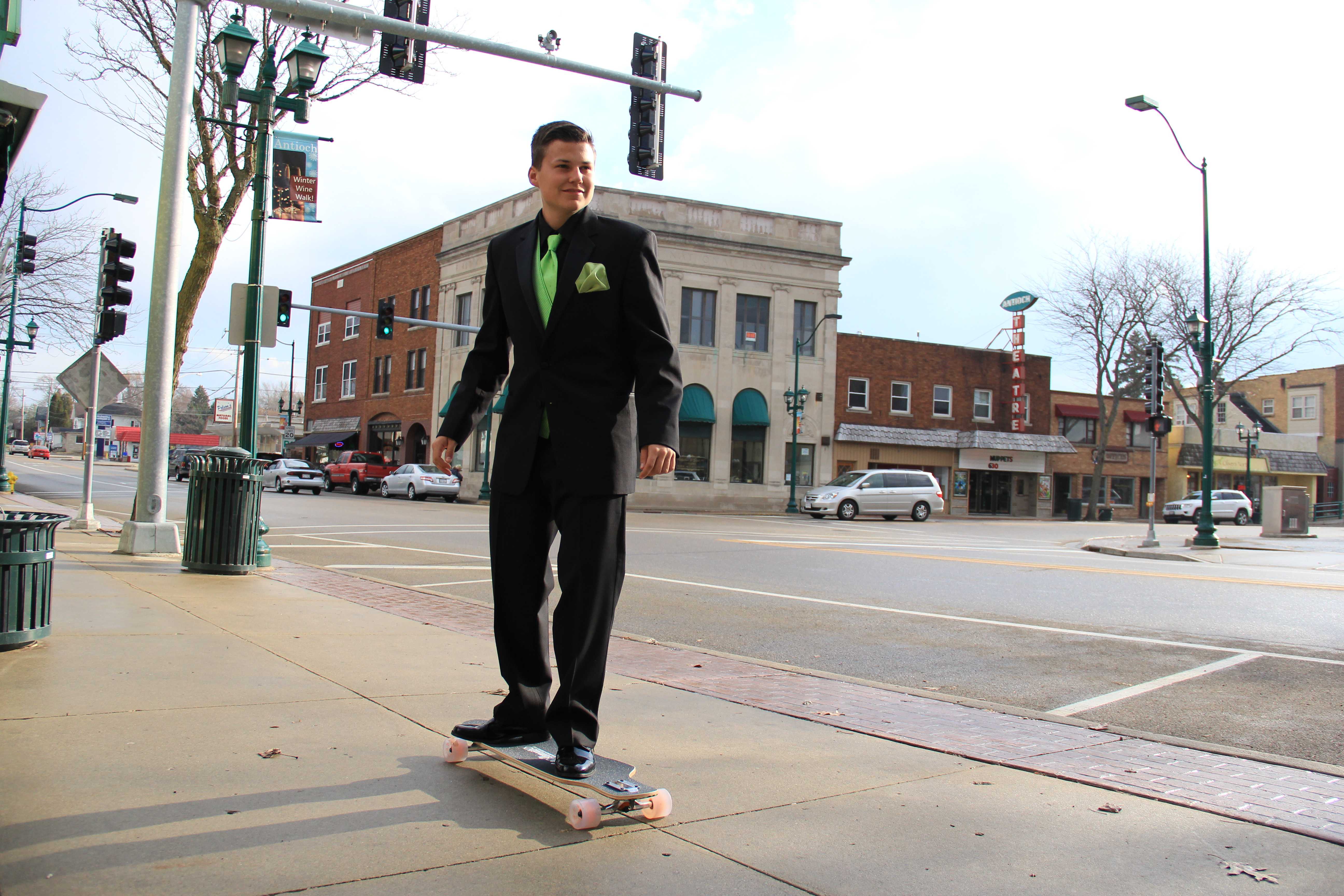 Senior Brandon Schwarz long boards in his prom tuxedo from BJ's Fashions For Men. Photo taken by Kyle Heywood