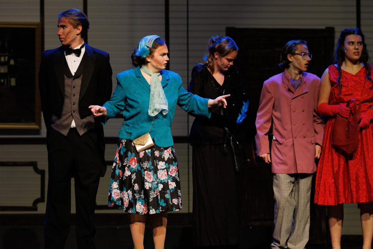 Senior Lucas Osborne (Wadsworth) and Julia Johnson (Mrs.Peacock) during the show on opening night 