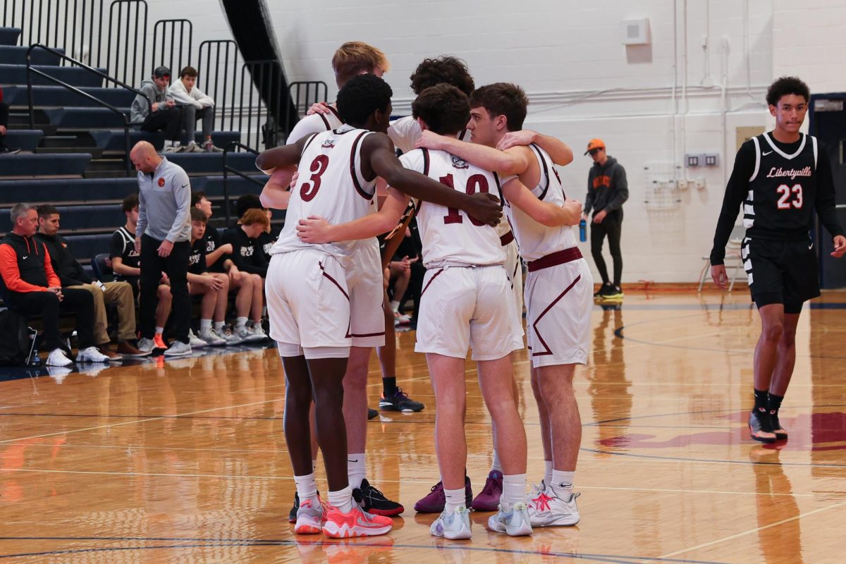 Sequoits starting five in a huddle before the Libertyville game at the St. Viator Thanksgiving Classic.  