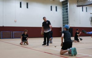 Varsity Assistant Coach May teaching the infield drill