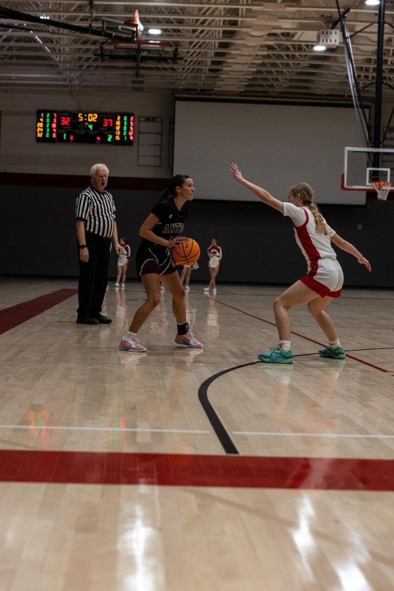 Senior Enza Nawrocki catches the ball at the three point line